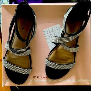 Black ankle strap sandals.